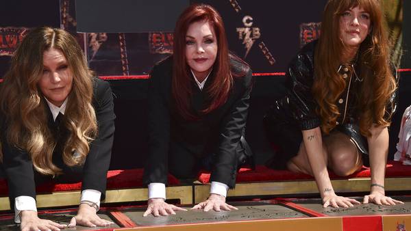 Photos: Elvis Presley's family place handprints in cement at the TCL Chinese Theatre 