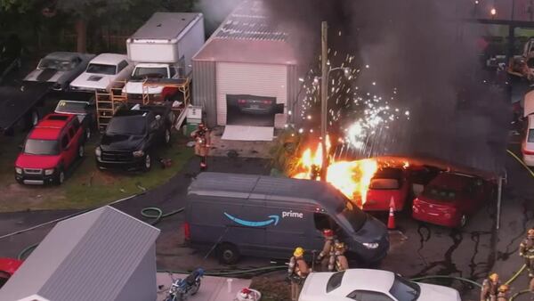 Photos: Fire rips through Orange County auto repair shop