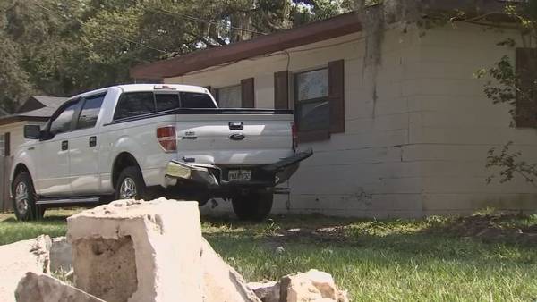 Video: Car crashes through brick wall into Orange County home