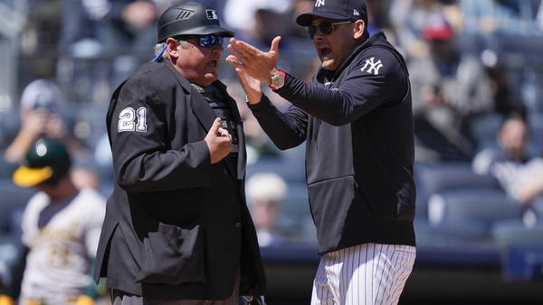 Yankees manager Aaron Boone is ejected 5 pitches into a game. He says a fan berated the umpire
