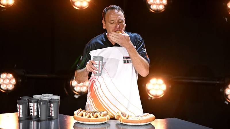 Joey Chestnut eating hotdogs