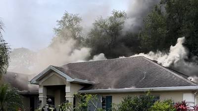 Photos: Crews battle house fire in Palm Bay