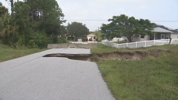 Heavy rains cause massive road damage in Palm Bay