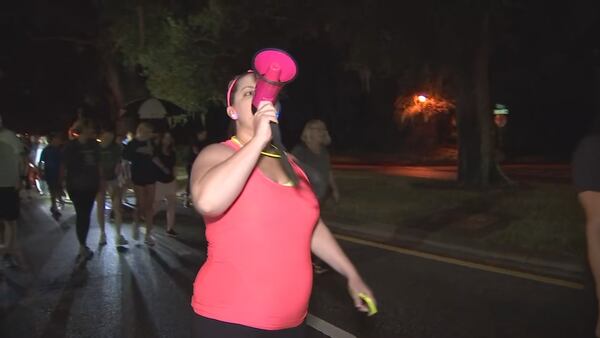 ‘Taking back the night’: Residents hold night walk in neighborhood where jogger was attacked