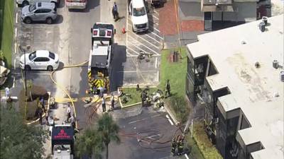 Photos: Adult and baby rescued after apartments catch fire in Orlando