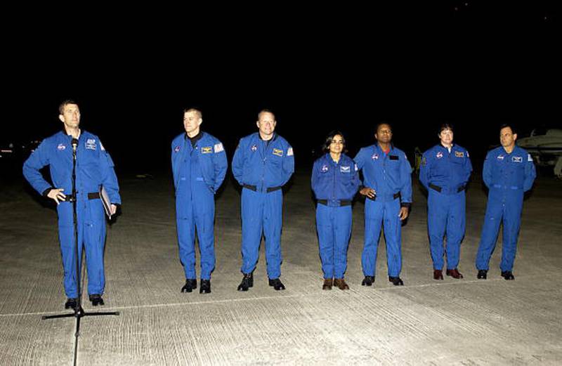 The crew of the Shuttle Space Shuttle Columbia STS-107 (L to R) Commander Rick Husband, Pilot William "Willie" McCool, Mission Specialists David Brown and Kalpana Chawla, Payload Commander Michael Anderson, Mission Specialist Laurel Clark and Payload Specialist Ilan Ramon talk to members of the press on January 12, 2003 at Kennedy Space Center in Cape Canaveral, Florida.  Columbia broke up upon re-entry to earth February 1, 2003. (Photo by NASA/Getty Images)