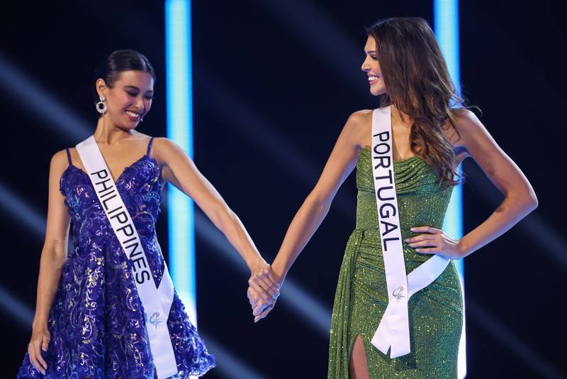 SAN SALVADOR, EL SALVADOR - NOVEMBER 18: Miss Philippines Michelle Marquez and Miss Portugal Marina Machete hold hands during the 72nd Miss Universe Competition at Gimnasio Nacional José Adolfo Pineda on November 18, 2023 in San Salvador, El Salvador. (Photo by Hector Vivas/Getty Images)