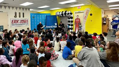 NASCAR driver visits local elementary school students, gives book vending machine