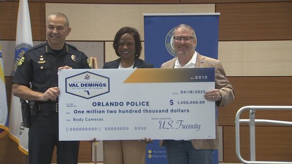 Congresswoman, former Orlando Police Chief Val Demings hands department funding for new body cameras