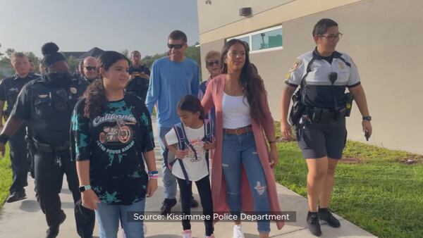 Video: Kissimmee police walk fallen officer Matthew Baxter’s daughters to first day of school