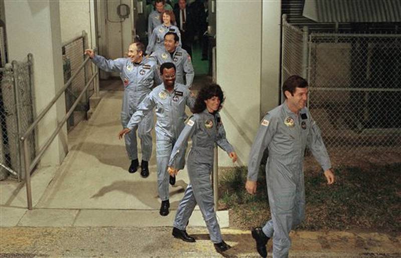 FILE - In this Jan. 27, 1986 file picture, the crew members of space shuttle Challenger flight 51-L, leave their quarters for the launch pad at Kennedy Space Center in Cape Canaveral, Fla. From foreground are commander Francis Scobee, Mission Spl. Judith Resnik, Mission Spl. Ronald McNair, Payload Spl. Gregory Jarvis, Mission Spl. Ellison Onizuka, teacher Christa McAuliffe and pilot Michael Smith. (AP Photo/Steve Helber)