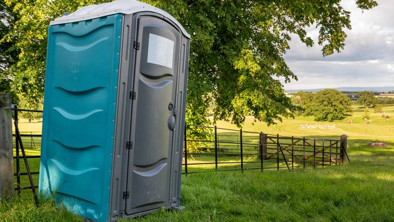 A man is facing charges after he reportedly pushed a porta-potty over with two people inside after an argument in Manchester, New Hampshire.