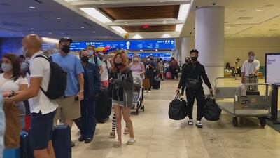 Thousands of travelers pack Orlando International Airport on the 4th of July