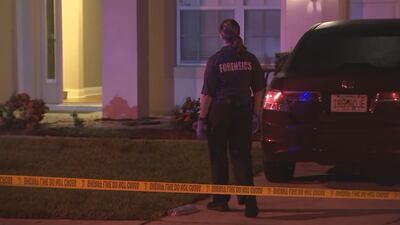 Photos: Police: Woman shot, son hurt when intruders enter Winter Park home