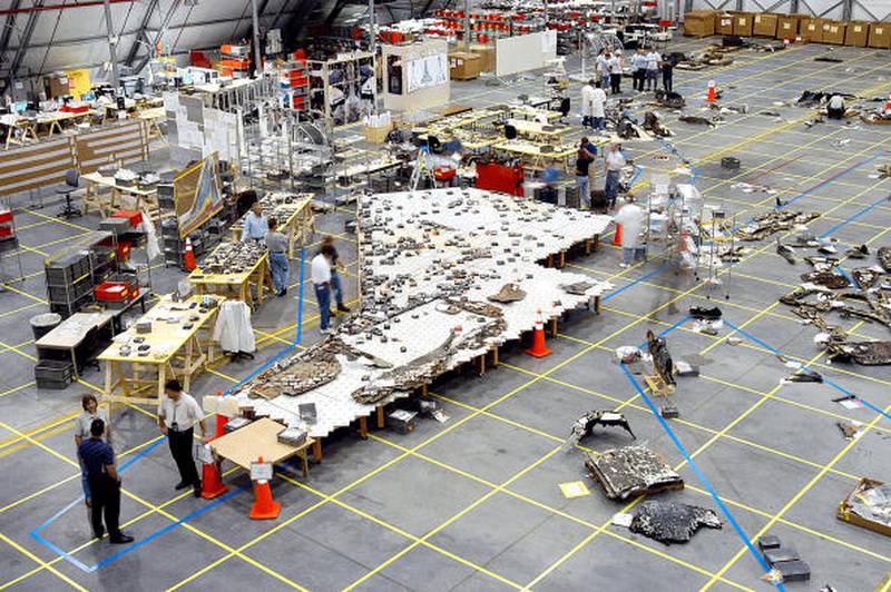 In this NASA handout, Columbia Space Shuttle debris lies floor of the RLV Hangar May 15, 2003 at Kennedy Space Center, Florida. More than 82,000 pieces have been delivered to the space center with 78,760 having been identified.  (Photo by NASA/Getty Images)