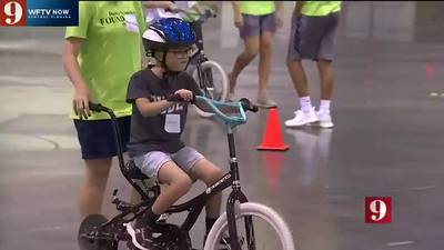 Local non-profit joins with summer camp to teach people with Down Syndrome, autism how to ride bikes