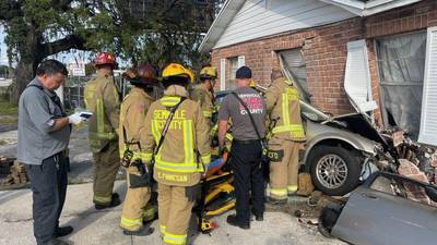 Photos: Two people injured after car crashes into Seminole County psychic shop
