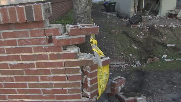 Photos: Driver crashes car through brick wall and into home in Orlando