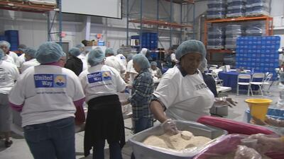 ‘We want to help as much as we can’: volunteers come together for ‘Share the Love’ food distribution