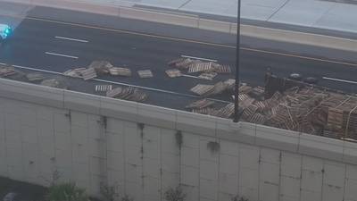 Video: Lanes of I-4 eastbound blocked after semi overturns, spills pallets on roadway