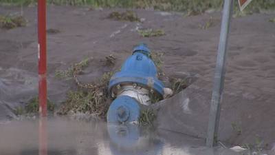 Photos: Cross county chase ends in crash which lead to street flooding in Belle Isle