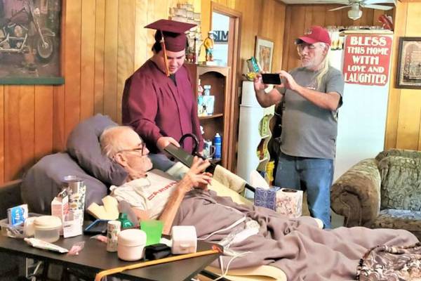 Alabama high school helps stage graduation for student’s fatally ill father