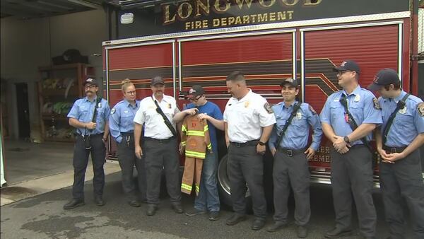 Photos: Longwood firefighters reunited with boy years after saving his life