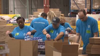 WATCH: Volunteers help prepare hurricane disaster relief packs for Second Harvest Food Bank