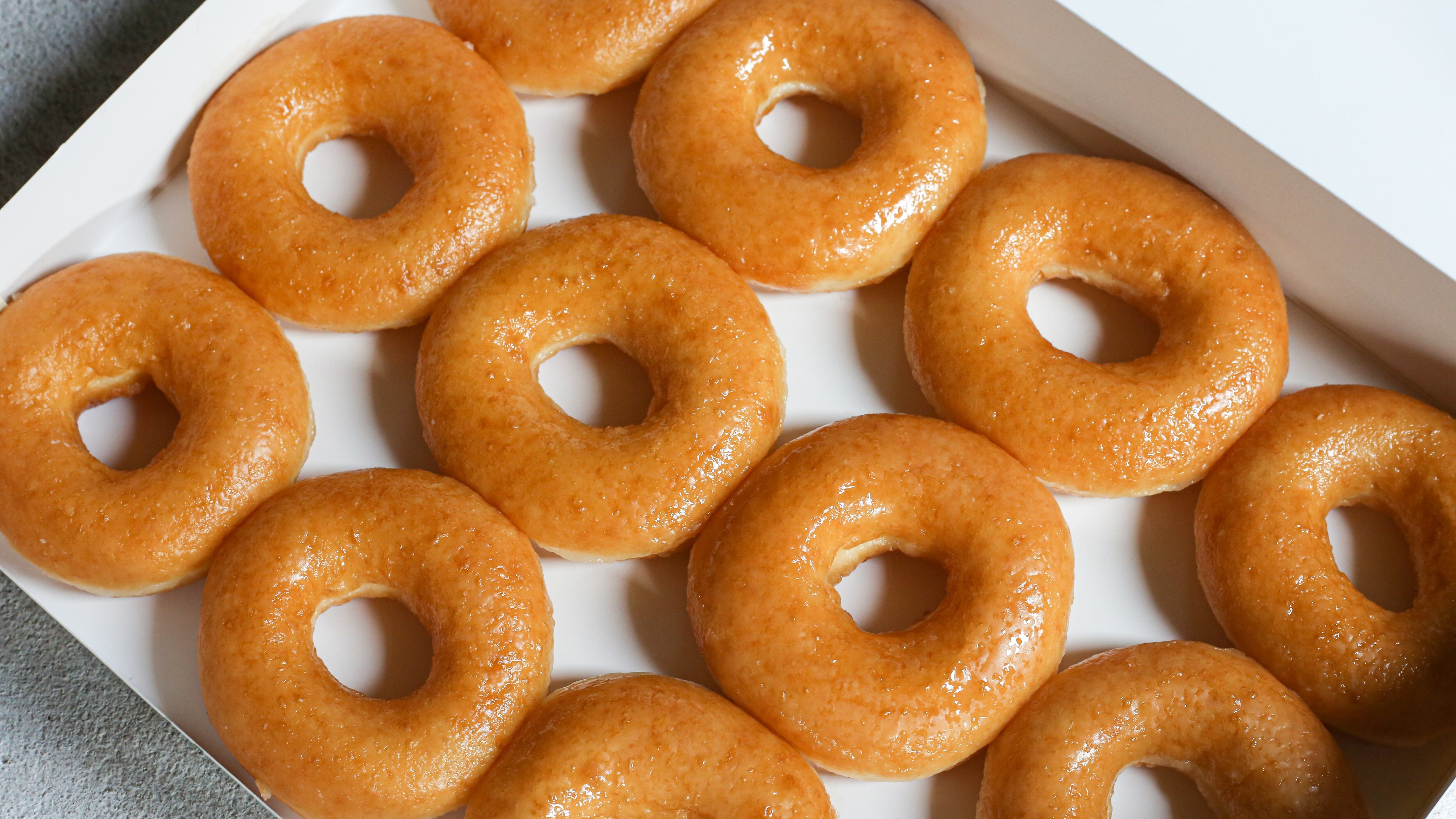 Glazed donuts original Delicious sugar pattern in box white, Selective focus