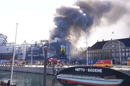 Black smoke billows from Denmark's Old Stock Exchange building.