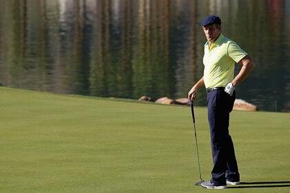 LA QUINTA, CA - JANUARY 17: Michael Bolton plays the eighteenth hole on the Arnold Palmer Private Course at PGA West during the second round of the Humana Challenge in partnership with the Clinton Foundation on January 17, 2014 in La Quinta, California. (Photo by Todd Warshaw/Getty Images)