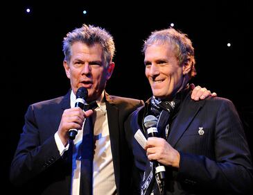 BEVERLY HILLS, CA - DECEMBER 09: Producer David Foster (L) and singer Michael Bolton perform onstage during the launch of The Andrea Bocelli Foundation at the Beverly Hilton Hotel on December 9, 2011 in Beverly Hills, California. (Photo by John Sciulli/Getty Images for Andrea Bocelli Foundation)
