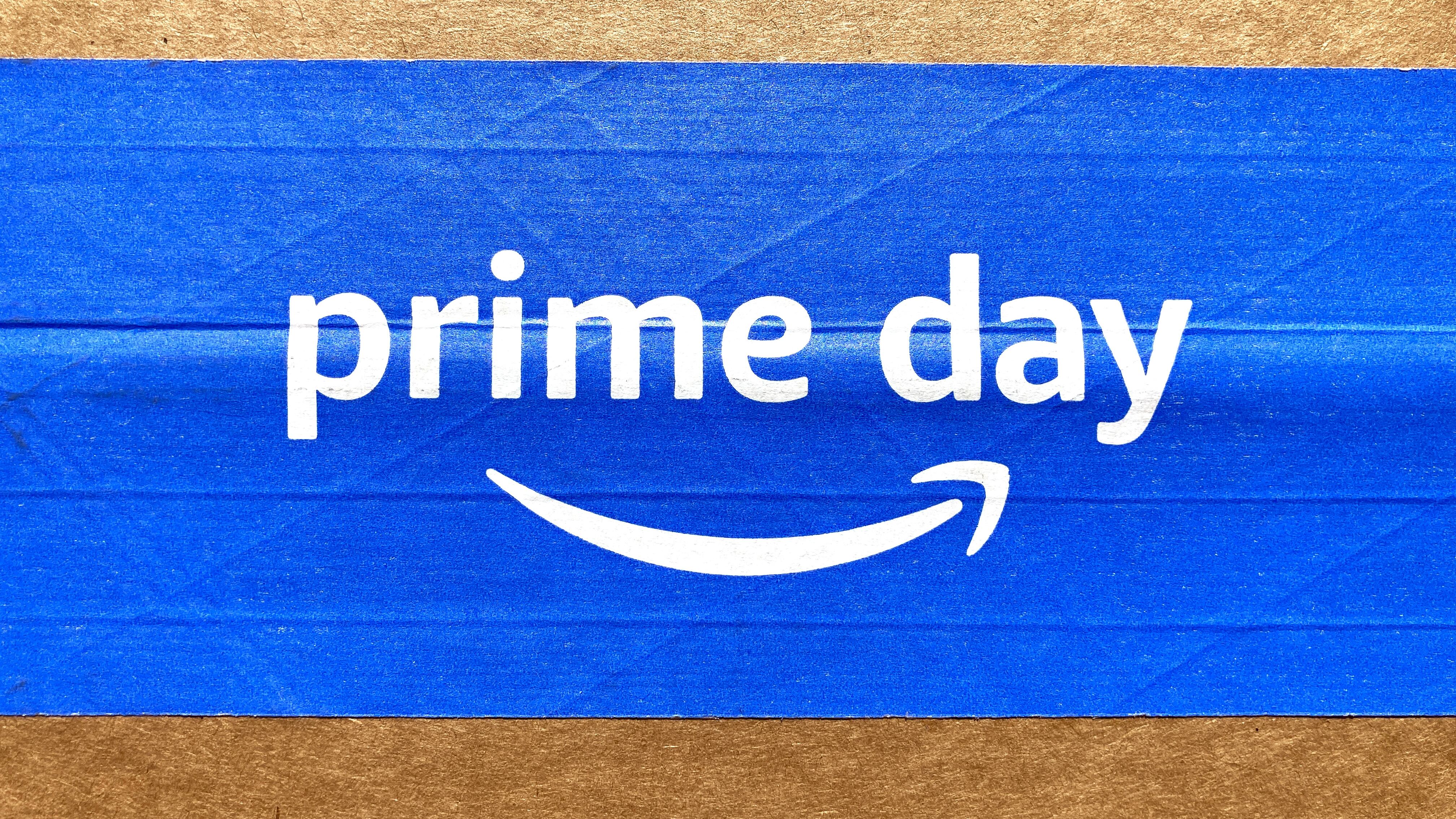 Amazon Prime Day sign, logo on blue tape of cardboard box advertises annual deal event exclusively for Amazon.com Prime members. - Seattle, Washington, USA - 2022