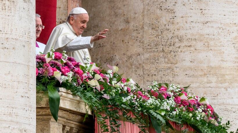 VATICAN CITY, VATICAN - MARCH 31: Pope Francis delivers his Urbi Et Orbi Blessing from the balcony overlooking St. Peter's Square on March 31, 2024 in Vatican City, Vatican. Following the Easter Sunday Mass, Pope Francis delivered his Easter message and blessing "To the City and the World," praying especially for the Holy Land, Ukraine, Myanmar, Syria, Lebanon, and Africa, as well as for victims of human trafficking, unborn children, and all experiencing hard times. (Photo by Antonio Masiello/Getty Images)