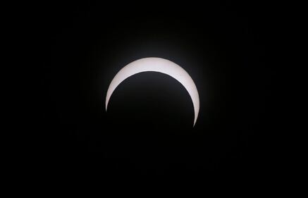 CAPITOL REEF NATIONAL PARK, UTAH - OCTOBER 14:  The moon crosses the sun as it exits the maximum eclipse during the Annular Solar Eclipse  on October 14, 2023 in Capitol Reef National Park, Utah. Starting at the Oregon coast and concluding on the east coast of South America an annular solar eclipse, where the moon is at its farthest from the Earth, will project a halo of sunlight around the moon's border.  (Photo by George Frey/Getty Images)