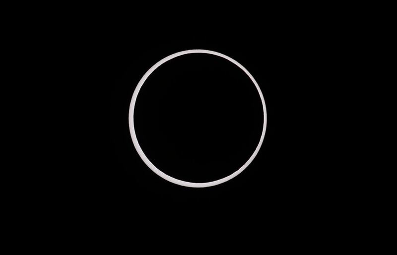 CAPITOL REEF NATIONAL PARK, UTAH - OCTOBER 14:  The moon crosses the sun completing its maximum eclipse during the Annular Solar Eclipse  on October 14, 2023 in Capitol Reef National Park, Utah. Starting at the Oregon coast and concluding on the east coast of South America an annular solar eclipse, where the moon is at its farthest from the Earth, will project a halo of sunlight around the moon's border.  (Photo by George Frey/Getty Images)