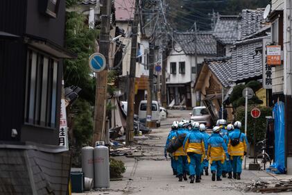 WAJIMA, JAPAN - JANUARY 05: Police officers search for survivors in the aftermath of an earthquake on New Year's Day on January 05, 2024 in Wajima, Japan. A series of major earthquakes have reportedly killed at least 92 people, injured dozens more and destroyed a large amount of homes. The earthquakes, the biggest measuring 7.1 magnitude, hit the areas around Ishikawa, Toyama and Niigata in central Japan on Monday. (Photo by Tomohiro Ohsumi/Getty Images)