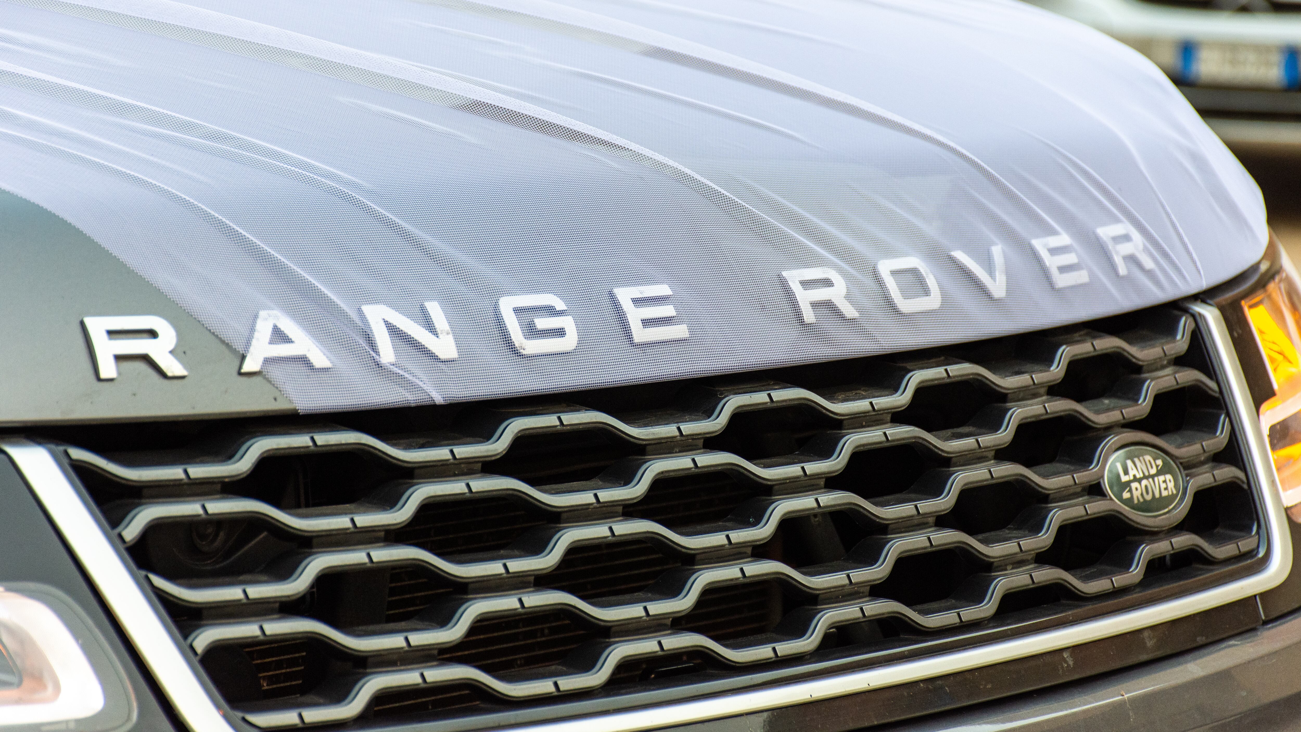 Range Rover written on a hood of an SUV
