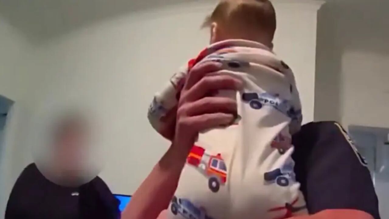 The baby was wearing pajamas sporting police cars and fire engines when police saved him.