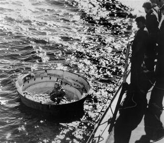 FILE - In this Jan. 31, 1986 file photo, Coast Guardsmen prepare to hoist the fulcrum of one of the space shuttle Challenger's solid rocket boosters onto the deck of U.S. Coast Guard cutter Dallas during salvage operations off the Florida coast. The Challenger exploded shortly after takeoff on Jan. 28. (AP Photo/File)