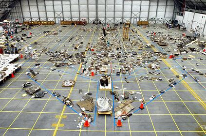 In this NASA handout, Columbia Space Shuttle debris lies floor of the RLV Hangar May 15, 2003 at Kennedy Space Center, Florida. More than 82,000 pieces have been delivered to the space center with 78,760 having been identified.  (Photo by NASA/Getty Images)
