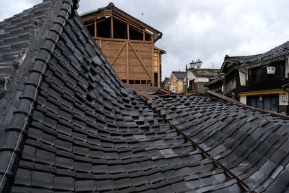 WAJIMA, JAPAN - JANUARY 05: Damaged houses are seen in the aftermath of an earthquake on January 05, 2024 in Wajima, Japan. On New Year's Day, a series of major earthquakes reportedly killed at least 92 people, injured dozens more and destroyed a large amount of homes. The earthquakes, the biggest measuring 7.1 magnitude, hit the areas around Ishikawa, Toyama and Niigata in central Japan. (Photo by Tomohiro Ohsumi/Getty Images)