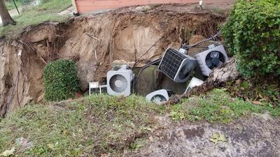 <p>The large hole opened outside one of the windows of the complex.</p>