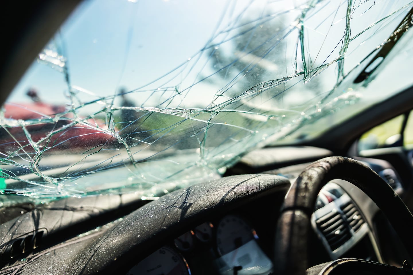 Closeup of a crashed car window in a car accident.