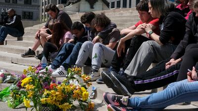 Family and friends of Karli Smith, who was killed during a mass shooting, attend a vigil in Indianapolis, Indiana on April 18, 2021 to remember the victims of a mass shooting at a local FedEx facility which took the lives of eight people.
