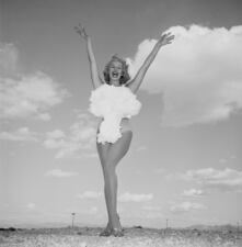 This image provided by the Las Vegas Convention and Visitors Authority shows Anna Lee Mahoney posing for a photo in Las Vegas, Nev., May 24, 1957. Mahoney, a showgirl at now-shuttered Sands Hotel, was known for decades by her stage name, Lee Merlin, or as "Miss Atomic Bomb." (Don English/Las Vegas News Bureau Collection, LVCVA Archive via AP)