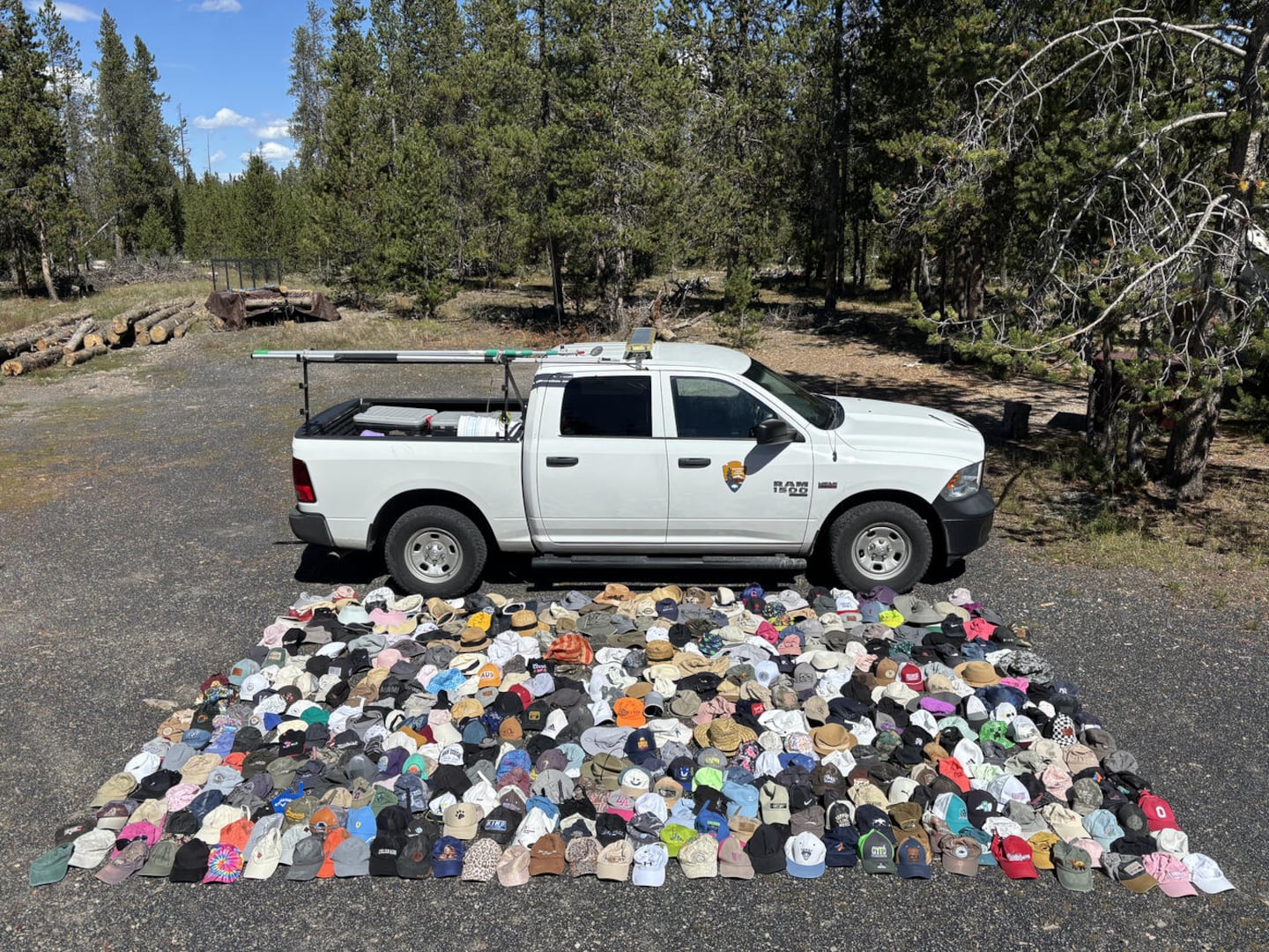 Hats lying on the ground in front of a truck