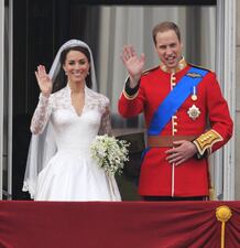Britain's Prince William and his wife Kate, Duchess of Cambridge wave from the balcony of Buckingham Palace after the Royal Wedding in London Friday, April, 29, 2011. (Matt Dunham ASSOCIATED PRESS)
