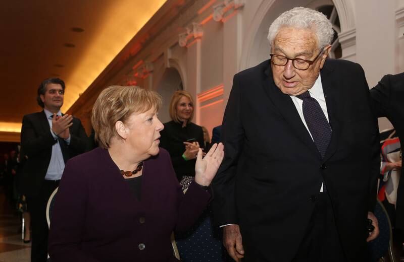 BERLIN, GERMANY - JANUARY 21: German Chancellor Angela Merkel (CDU, L) arrives with former United States Secretary of State and National Security Advisor Henry Kissinger for the ceremony for the Henry A. Kissinger Prize on January 21, 2020 in Berlin, Germany. The annual prize is awarded by the American Academy in Berlin for "outstanding service" to transatlantic relations. The 2019 edition of the award was given to Merkel. (Photo by Adam Berry/Getty Images)